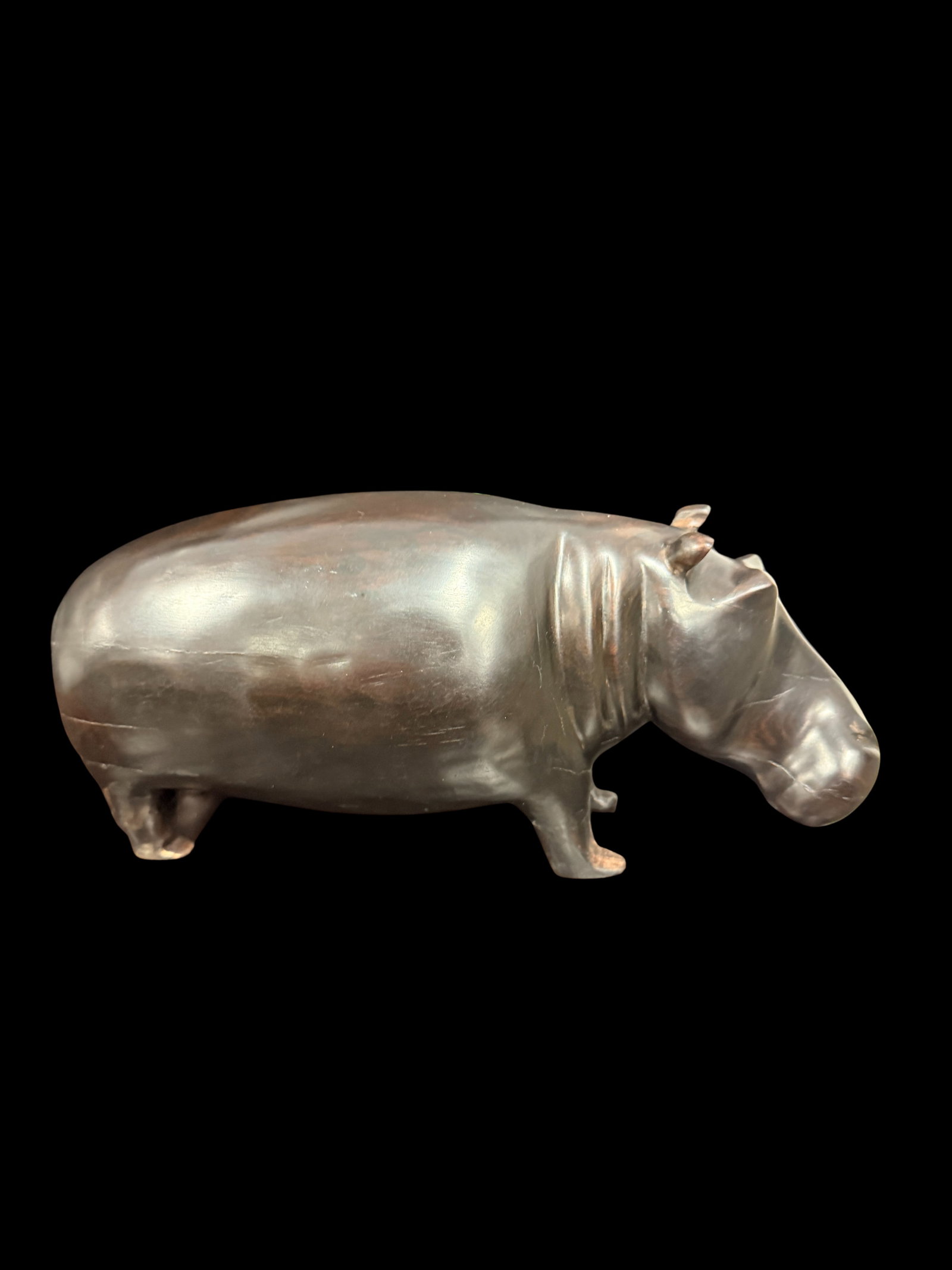Bronze like Patina Hippo Sculpture Figurine 2 lbs: A substantial and finely detailed hippopotamus sculpture cast in dark bronze-patinated metal. The figure captures the hippo in a naturalistic standing pose with remarkable anatomical accuracy — from