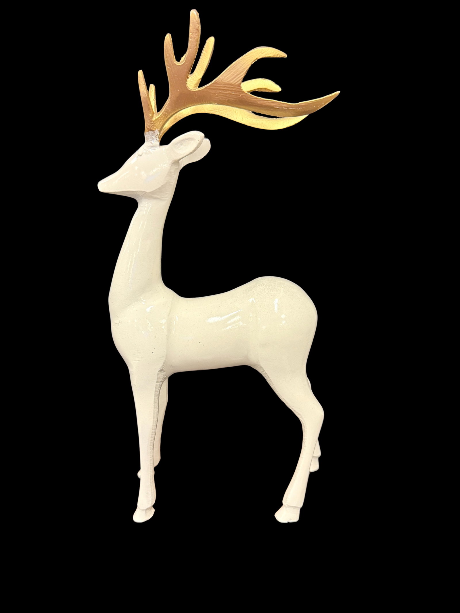 White Ceramic Deer Figurine with Gold Antlers: A white ceramic deer figurine with elegant gold antlers, a modern decorative piece with clean lines. Contemporary animal figurines with metallic accents are popular home decor collectibles.
