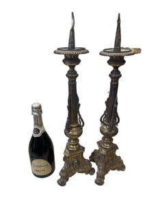 19th-century Italian Renaissance-style bronze altar candlesticks featuring a distinct filigree top: This magnificent pair of 19th-century Italian Renaissance-style bronze altar candlesticks perfectly captures the majestic grandeur of antique ecclesiastical decor. Standing a stately 22" H with a 6" W