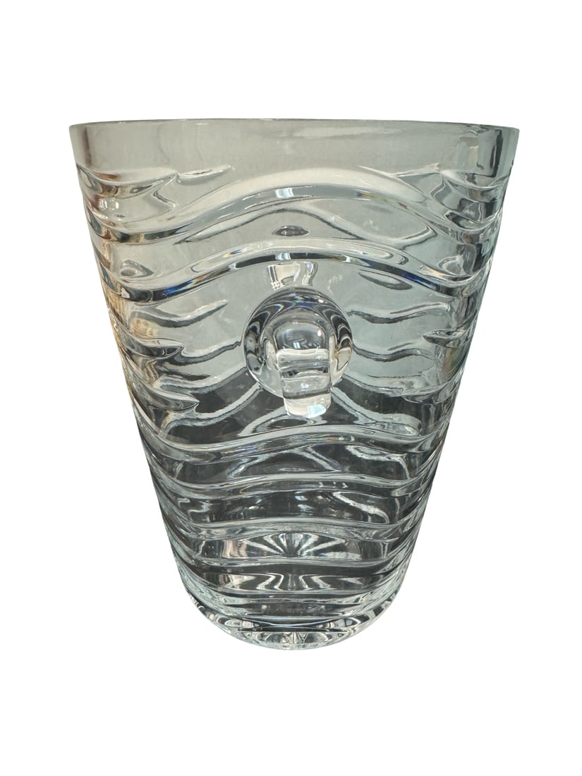 Contemporary Wavy Clear Glass Vase w/: This contemporary style clear glass vase features a dynamic horizontal wave pattern across its entire body. It is accented by two small scrolled handles on opposite sides and a radial starburst patter