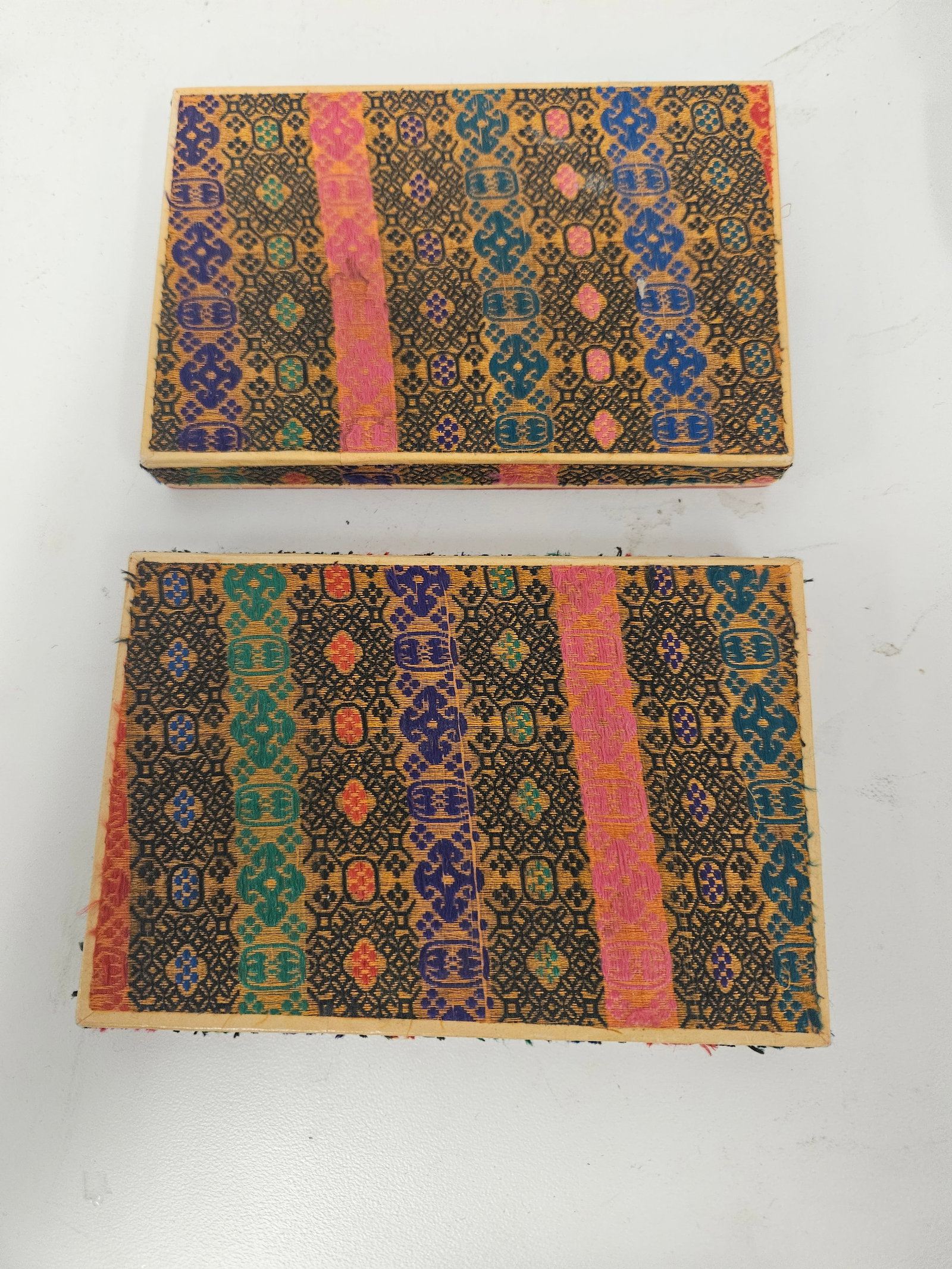 Two Sets Chinese Goldfish Ink Sticks: Two Vintage sets of Chinese ink sticks featuring hand-painted goldfish and aquatic motifs in vibrant colors and gilt accents. Each set of four rectangular sticks is housed in its original