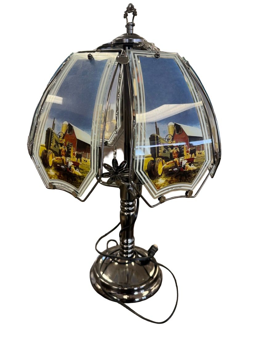 Farm Life Glass Panel Touch Lamp: This vintage-inspired touch lamp features a polished chrome-finished metal base with three candlestick-style light sockets. The hexagonal shade is composed of six curved glass panels, each decorated