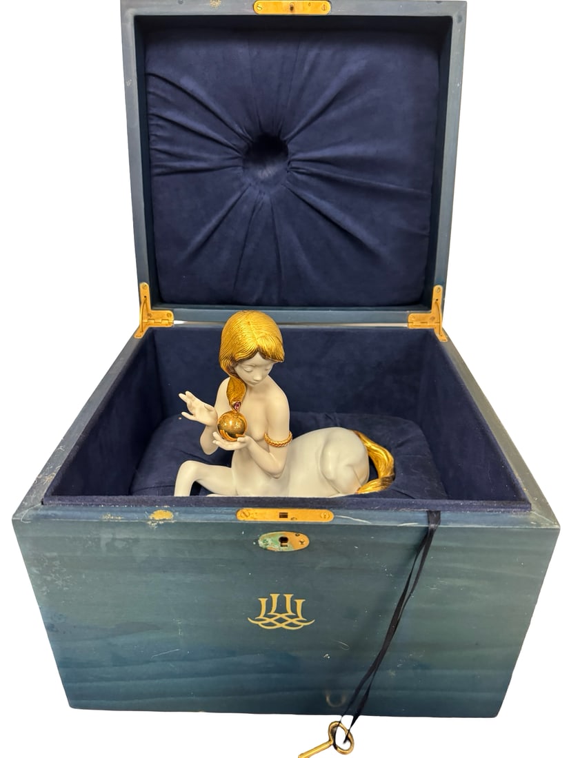 Lladró "Centaura" with a pink sapphire: Spanish Name: CENTAURA (ZAFIRO ROSA)Sculptor: Virginia GonzalezYear Issued: 2001Year Retired: 2020Finish: High PorcelainLast Retail: $8,250.00 Height (in): 6.75Width (in): 7.75The Legend Collection. L