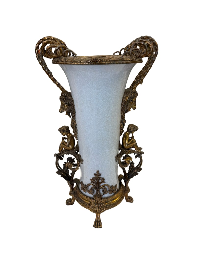 French Style Bronze-Tone Mounted Vase: An ornate crackle-glazed ceramic vase featuring substantial bronze-tone metal mounts in the French Empire style. The piece is flanked by elaborate handles terminating in rams' heads with seated putti