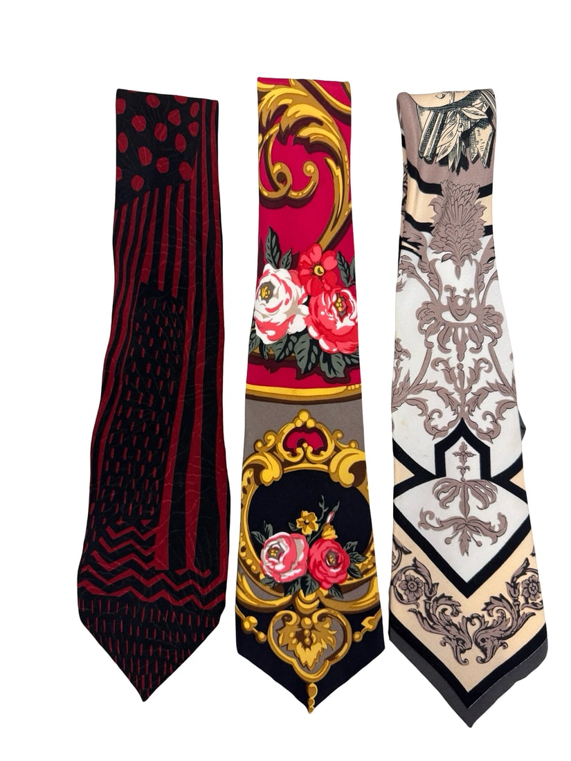 24 Collection by Laura Pearson Lot of 3: A curated lot of three vintage men's silk neckties, likely from the late 1980s or early 1990s, showcasing the opulent "scarf print" style of the era. These ties were created for The 24 Collection, a