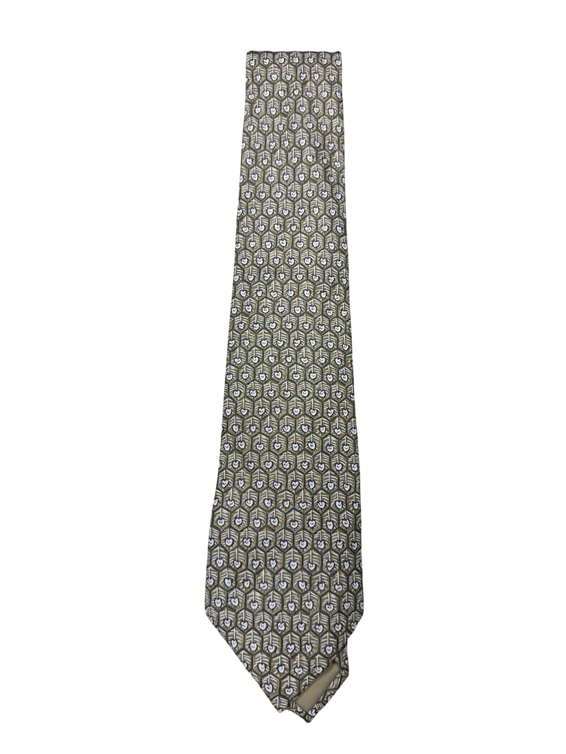 Hermès Silk Geometric Necktie: This Hermès silk necktie features a sophisticated olive and cream geometric pattern resembling stylized feathers or leaves. The piece includes iconic branding elements, including the carriage