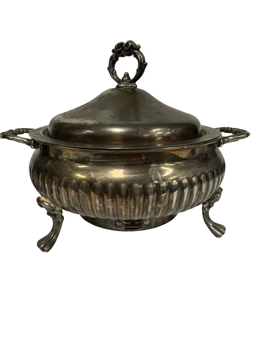 English Silver Mfg. Corp. silverplate: This vintage silver-on-copper chauffer features a gadrooned body supported by three scrolled feet. The piece includes a domed matching lid with an ornate finial and classic scrolled side handles for