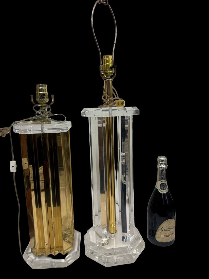 Pair of Hollywood Regency Table Lamps: This set features two substantial table lamps designed in the Hollywood Regency style with a focus on geometric forms. One lamp is constructed with an accordion-style faceted gold-tone metal body,
