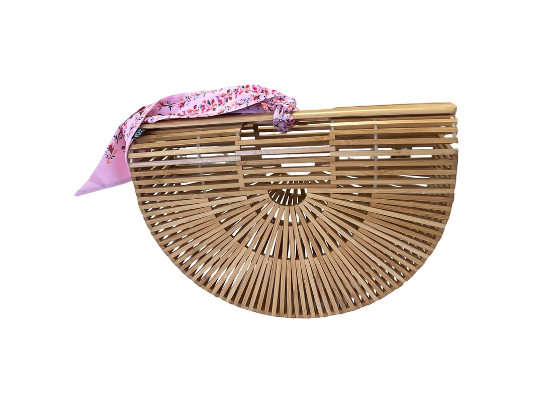 Bamboo Half-Moon Gaia Style Handbag: This stylish handbag is crafted in a distinctive half-moon silhouette following the classic Gaia's Ark design. Constructed from natural finish bamboo slats, the bag features flat top handles and an op