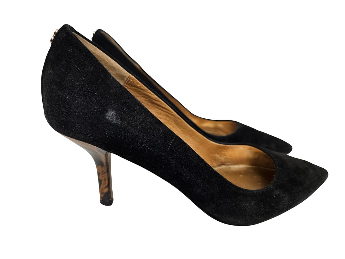 Coach Black Suede Pointed Toe Pumps: This pair of Coach black suede pumps features a classic pointed toe and an elegant kitten heel with a tortoise shell pattern. The interiors are finished with metallic gold-tone footbeds bearing the em