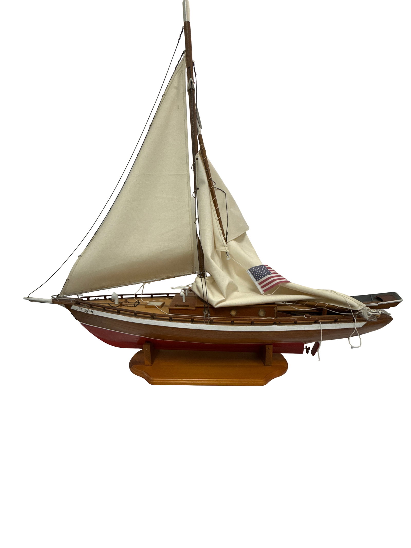 Large Wooden 'Joe Boy' Model Sailboat: A large-scale wooden pond yacht model titled 'JOE BOY' featuring a planked wood hull with red bottom paint. The sailing ship includes a tall mast with fabric sails, a small lifeboat on deck, and an Am