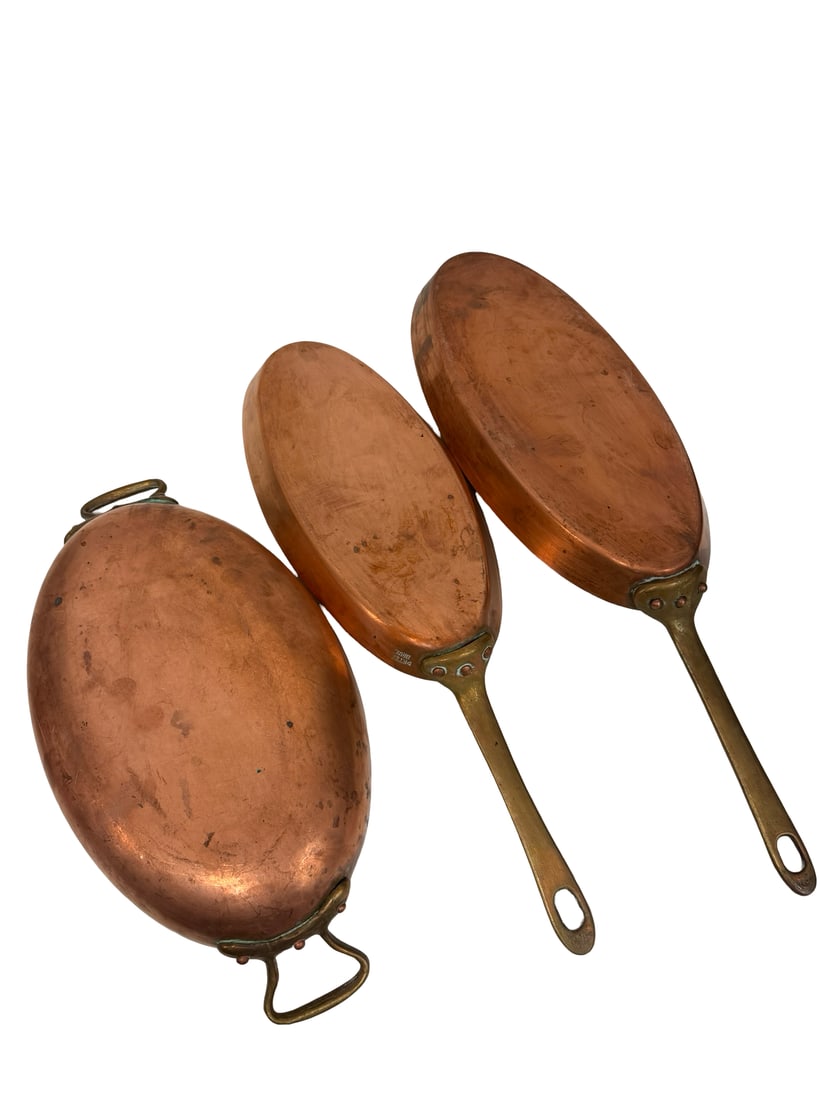 3pc Peter Brux Style Copper Fish Pans: A three-piece set of oval copper cookware including one double-handled au gratin pan and two long-handled sauté pans. All pieces feature heavy-gauge copper construction with brass handles
