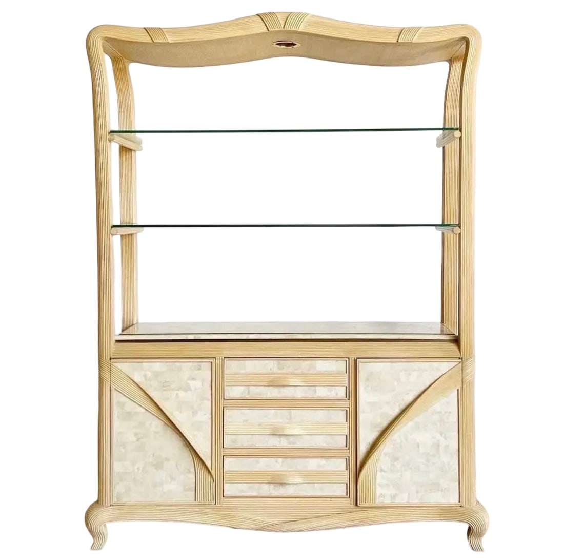 Reeded Rattan & Tessellated Stone Hutch: This elegant Hollywood Regency style hutch features a split-reed rattan frame with a decorative undulating crest and integrated downlighting. The lower cabinet is adorned with tessellated stone or fau