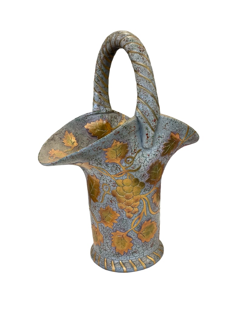 Grapevine Motif Ceramic Basket: This decorative ceramic basket features a textured crackle glaze finish in a muted blue and gray palette. It is adorned with raised relief grape clusters and vine leaves highlighted with metallic