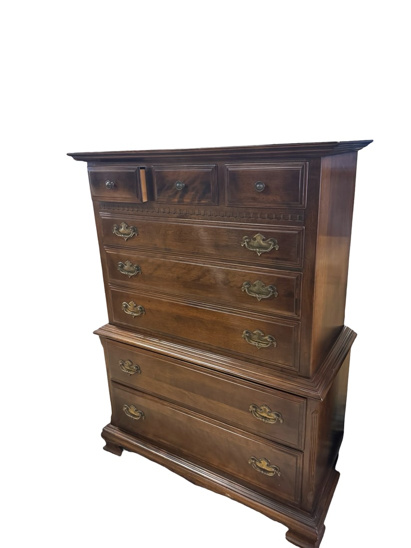 Vintage Ethan Allen Chest-on-Chest: Vintage Ethan Allen chest-on-chest features a rich dark wood finish and elegant brass-tone batwing pulls. The upper section consists of three small top drawers over three full-width drawers, while the
