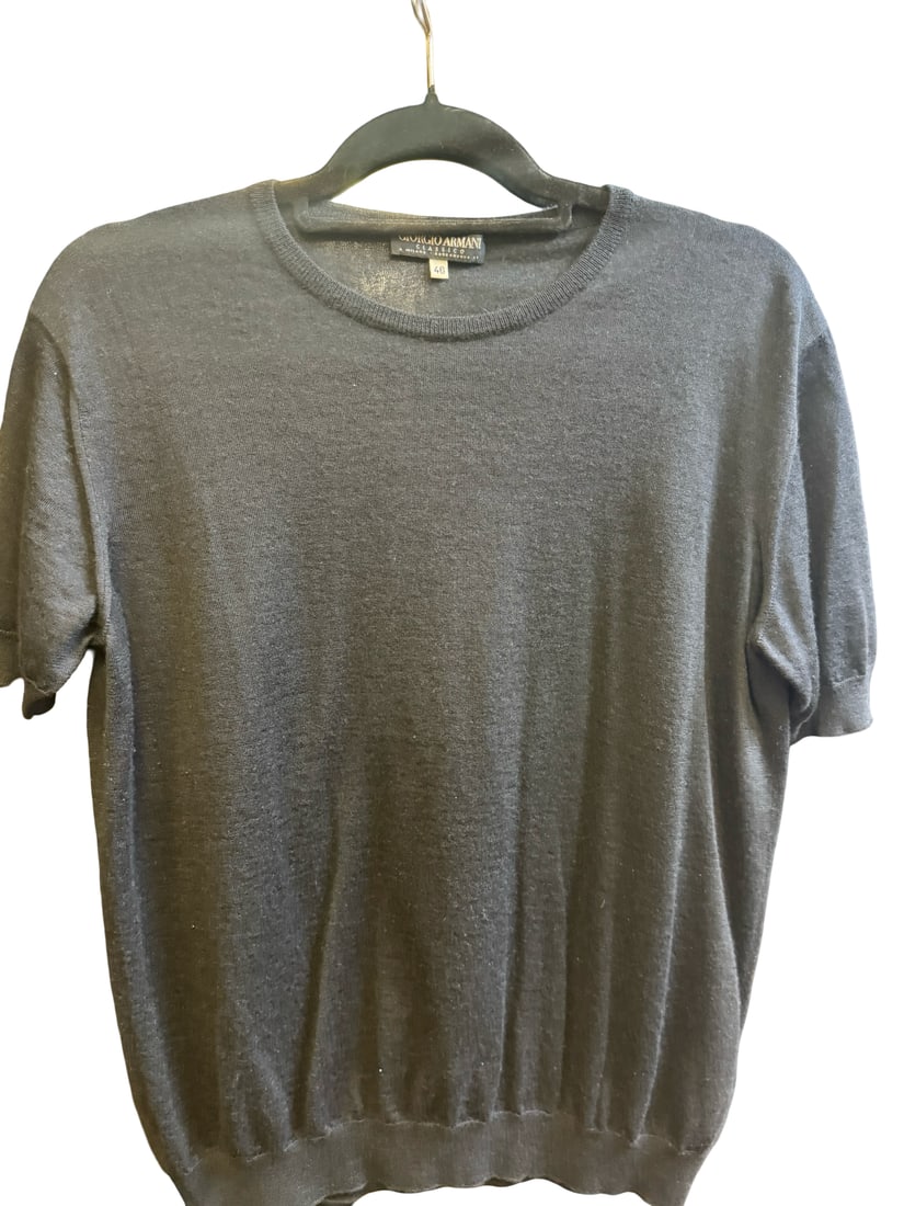Giorgio Armani Classico Knit Top Sz 46: This short-sleeved knit top features a classic crew neck design in a charcoal grey colorway. The garment is constructed from a fine-gauge knit material, likely a wool or silk blend consistent with
