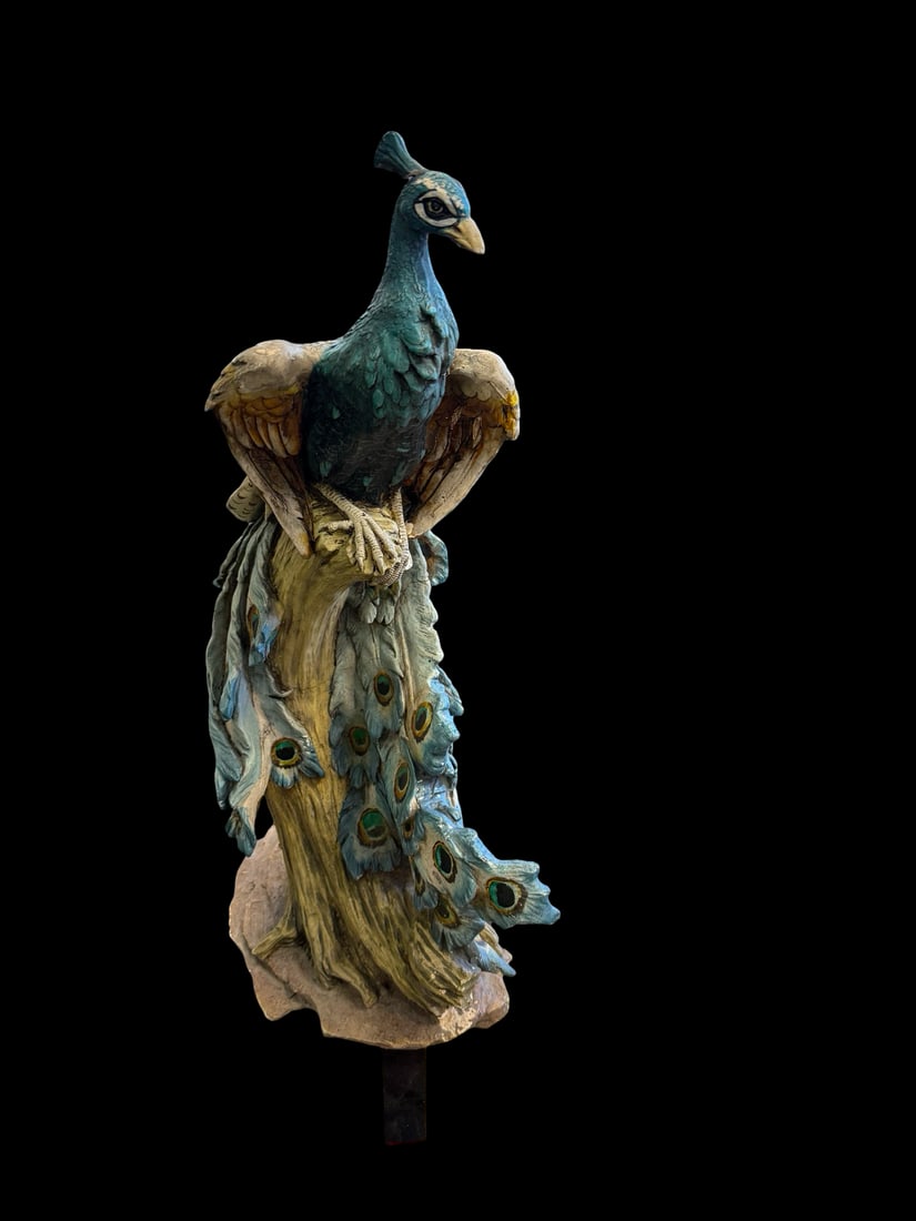 Large 22?? Hand-Painted Peacock Sculpture: This large peacock figurine is crafted from cast resin or composite material and features a hand-painted finish in shades of blue, green, and gold. The bird is depicted perched atop a textured tree
