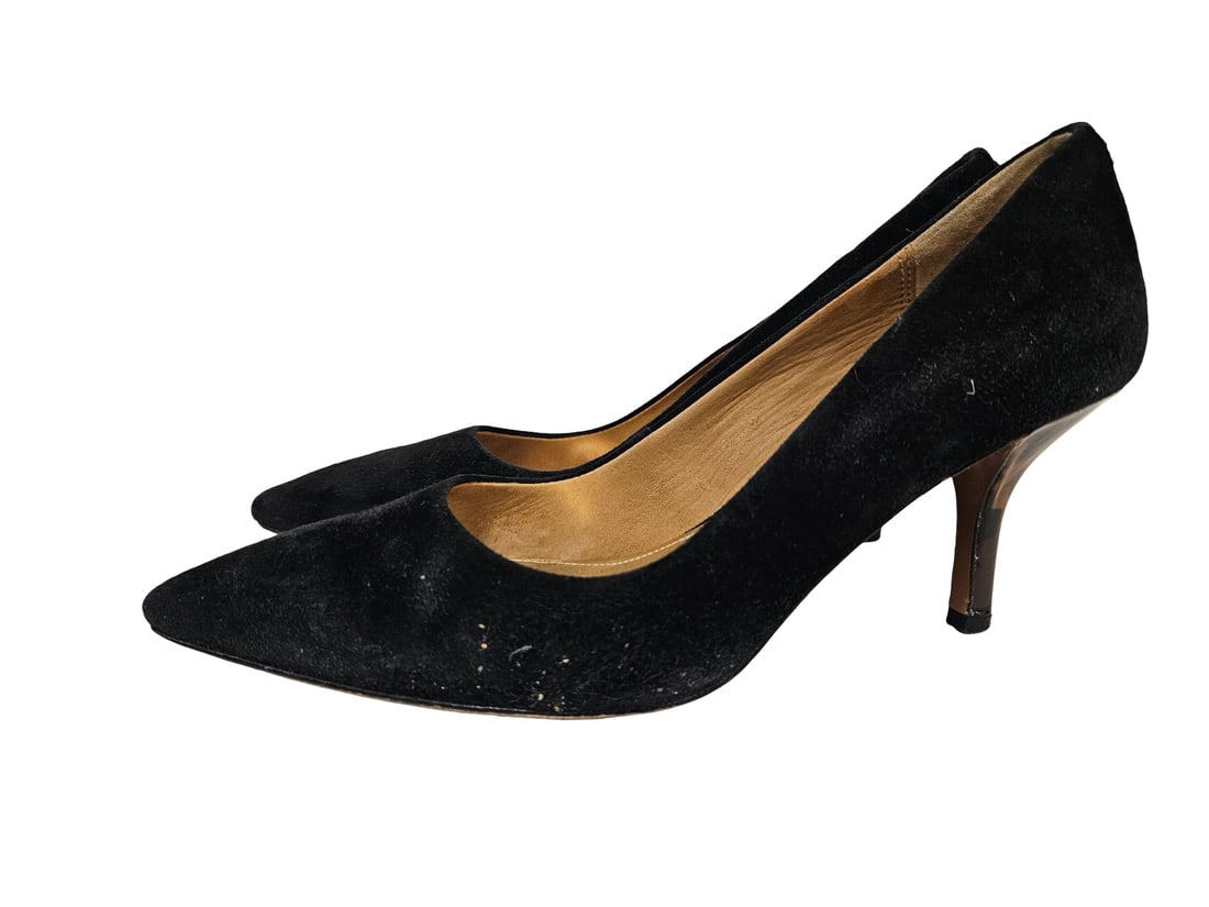 Coach Black Suede PointedToe Pumps (S-7): This pair of Coach black suede pumps features a classic pointed toe and an elegant kitten heel. The interiors are lined with a striking gold-tone material bearing the brand's logo, while the heels sho