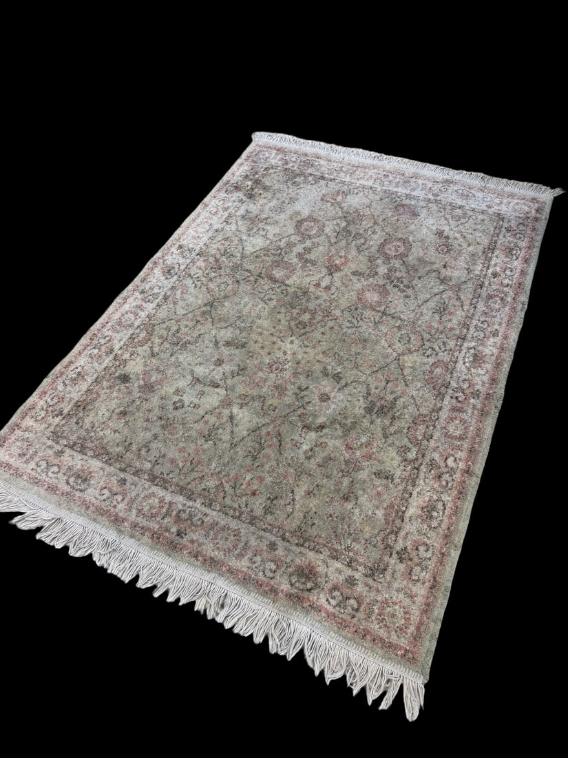 Distressed Traditional Floral Area Rug: This machine-woven area rug features a traditional Persian-style floral pattern with a central field of muted greens and pinks. The design is framed by a decorative border and finished with cream-colo
