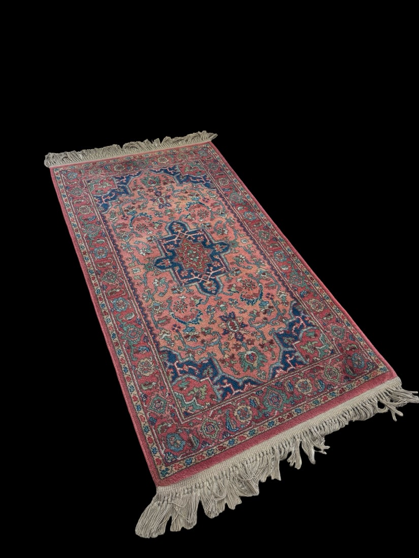 Karastan Medallion Serapi Wool Rug: This Karastan wool rug features the Medallion Serapi pattern with a striking central motif and floral borders. The color palette includes shades of coral, cream, and deep blue, crafted from 100% worst