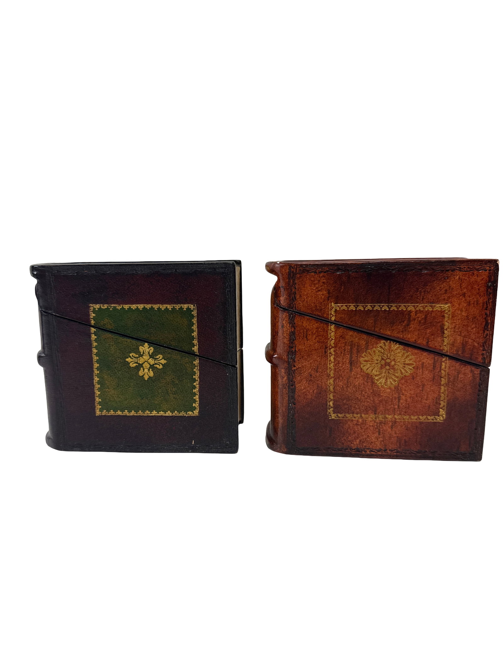 Pair of Maitland-Smith Leather Faux Book Boxes: Two decorative coaster sets by Maitland-Smith designed as faux leather stacked books with embossed leather-style finishes. Each lidded box contains four matching coasters with gilded accents and