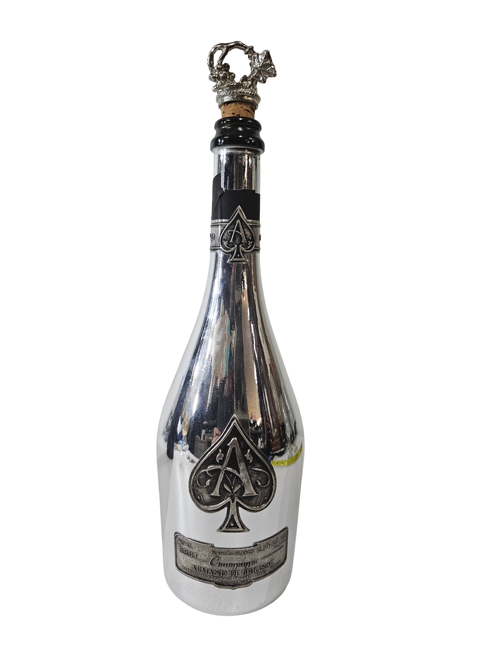 Armand de Brignac Silver Display Bottle: This empty Armand de Brignac 'Ace of Spades' Blanc de Blancs silver-tone display bottle features the brand's iconic pewter spade labels. The bottle is topped with an ornate decorative metal and cork g