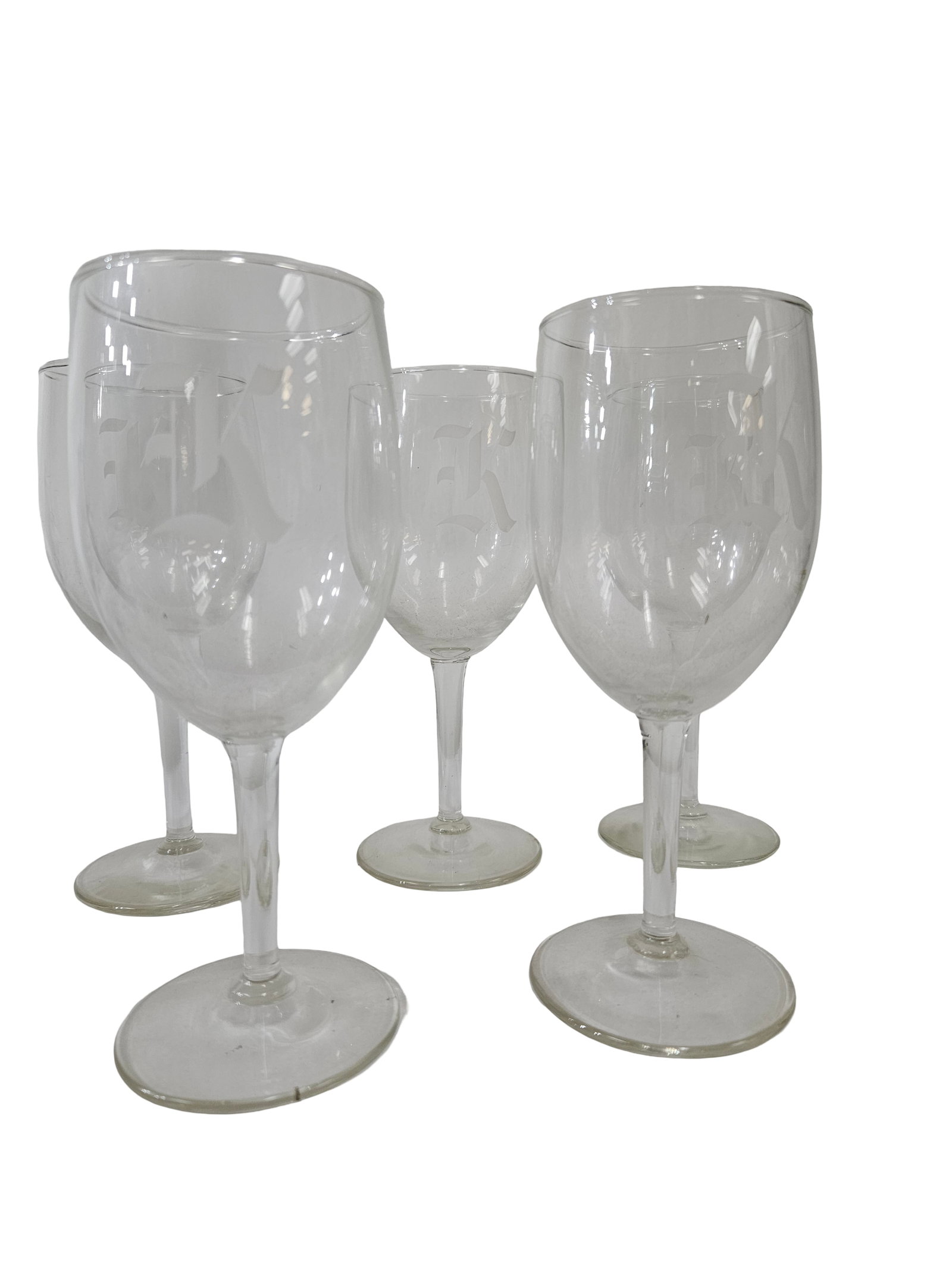 Set of 5 Monogrammed 'K' Wine Glasses: This collection features five clear glass stemmed wine goblets featuring a frosted monogram. Each glass is etched with a Gothic or Old English style letter 'K' on the bowl. The set includes five