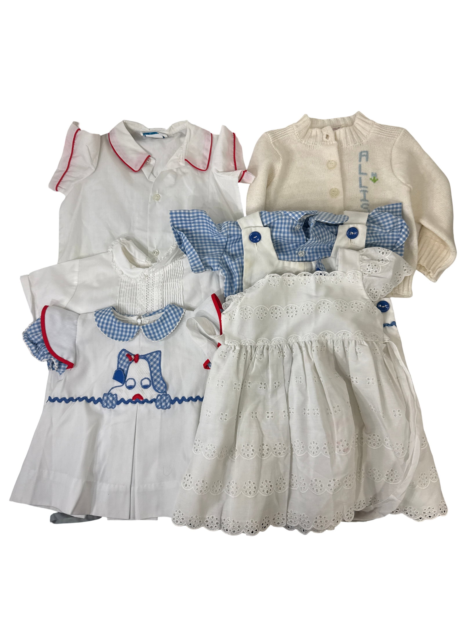 Vintage Children's Embroidered Clothing: This charming collection includes six pieces of vintage children's clothing, featuring embroidered and eyelet details. The lot comprises a white eyelet dress, a blue gingham and white romper set with