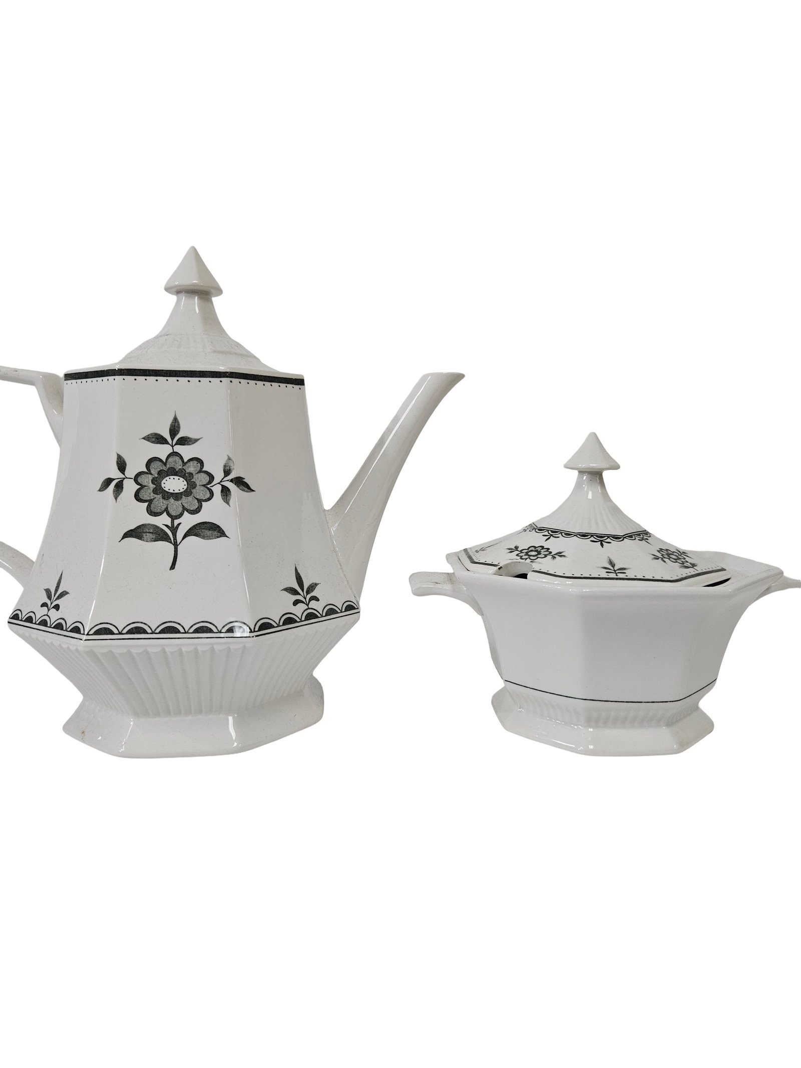 Vintage Black & White Floral Tea Set: This vintage tea service set includes a lidded teapot and a matching lidded sugar bowl or sauce tureen with handles. Both pieces feature a white ceramic body decorated with a distinctive black floral 