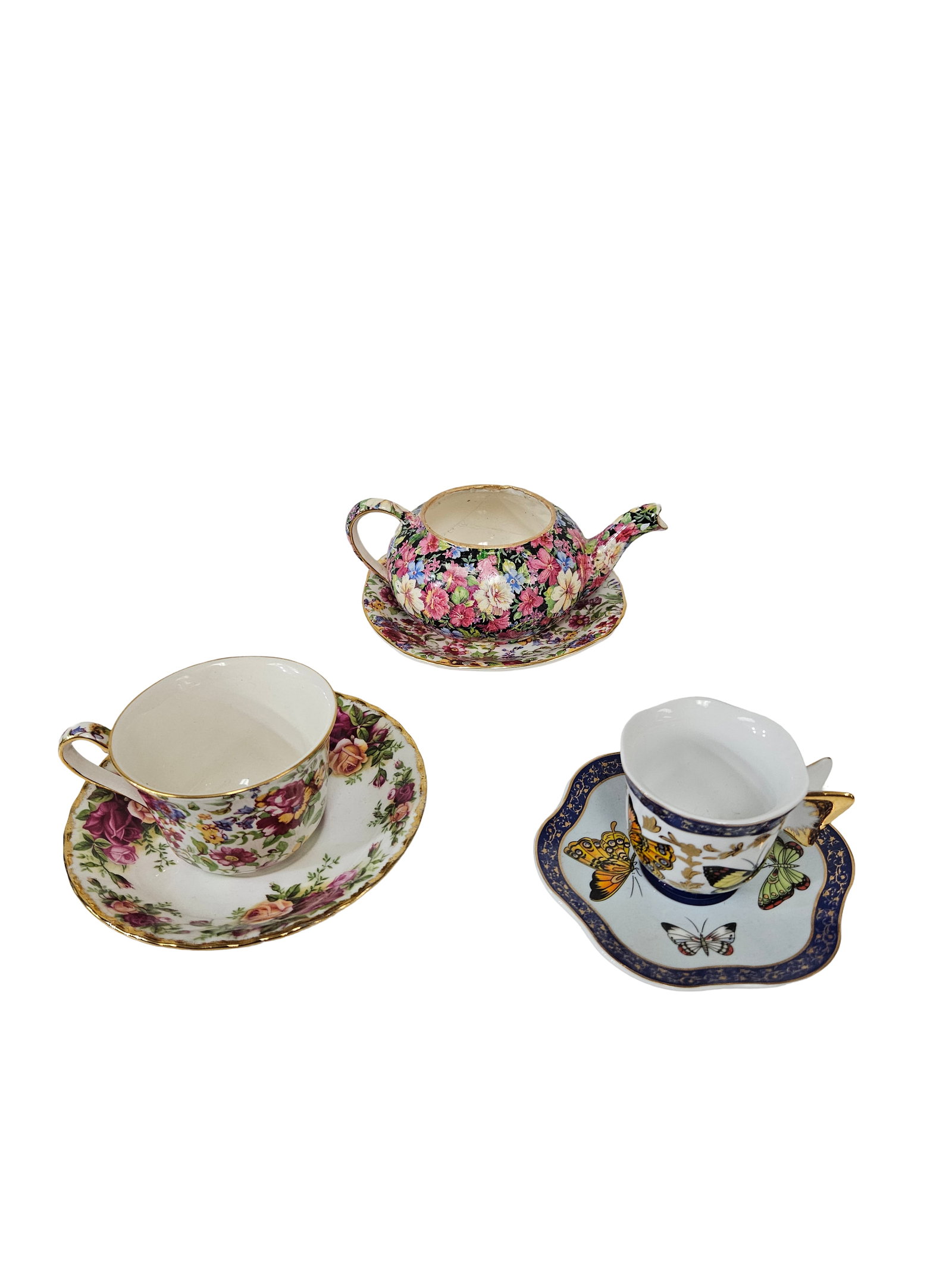 3 Mixed Teacup & Saucer Sets w/ Teapot: This charming collection includes three sets of decorative teacups and saucers with various floral and nature motifs. One set is marked Royal Winton Summertime with a Royal Albert Old Country Roses sa