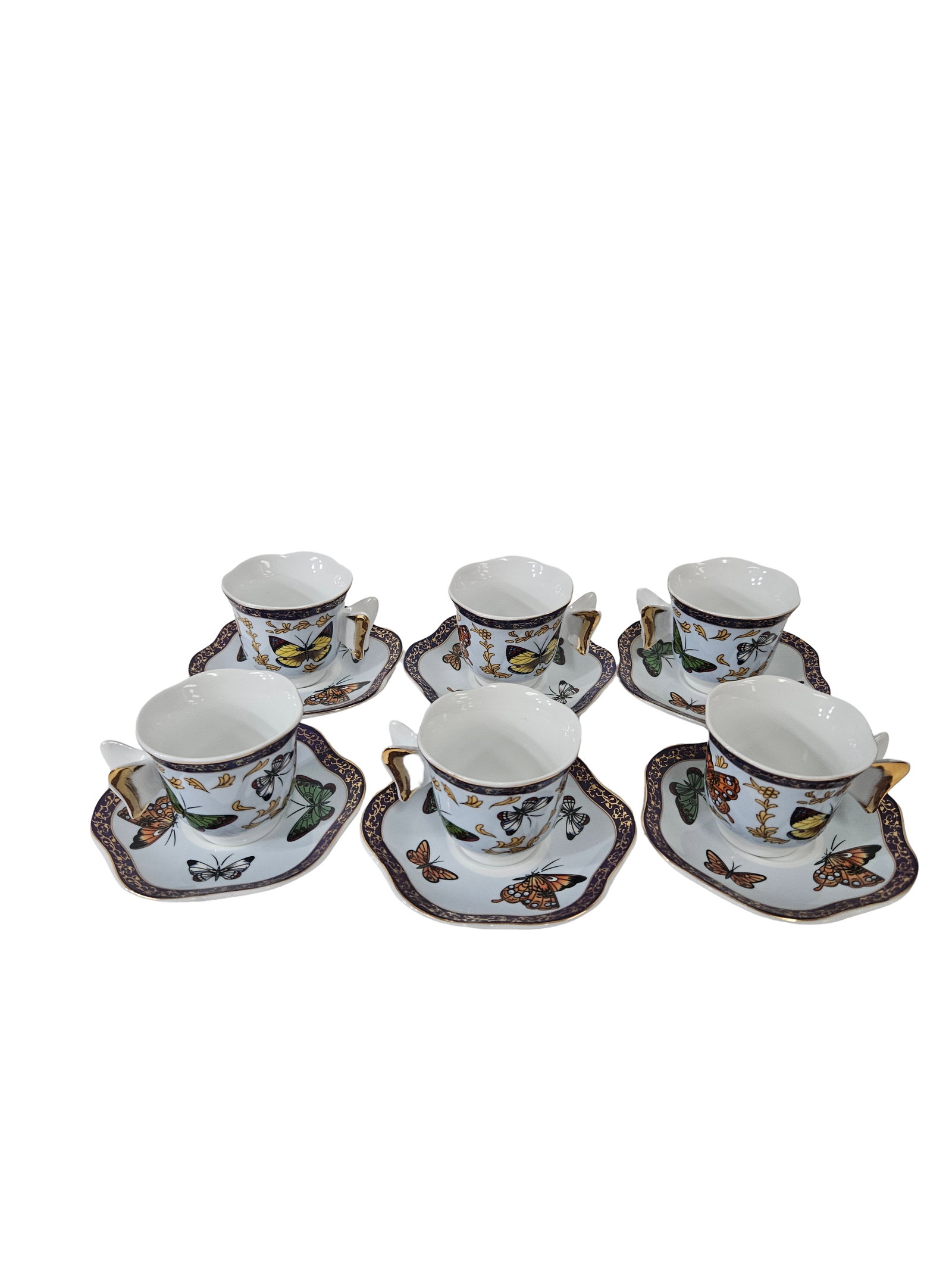 12pc CC&T Butterfly Porcelain Cup Set: This attractive set includes six porcelain cups and six matching scalloped saucers featuring a vibrant butterfly and botanical motif. Each piece is accented with a decorative purple grape-patterned