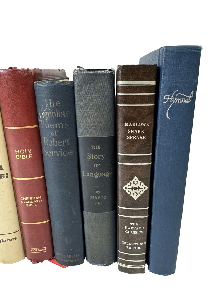 Collection of 7 Vintage Hardcover Books: A collection of seven vintage books featuring a mix of literature, religious texts, and non-fiction. The lot includes titles such as The Complete Poems of Robert Service, a Harvard Classics