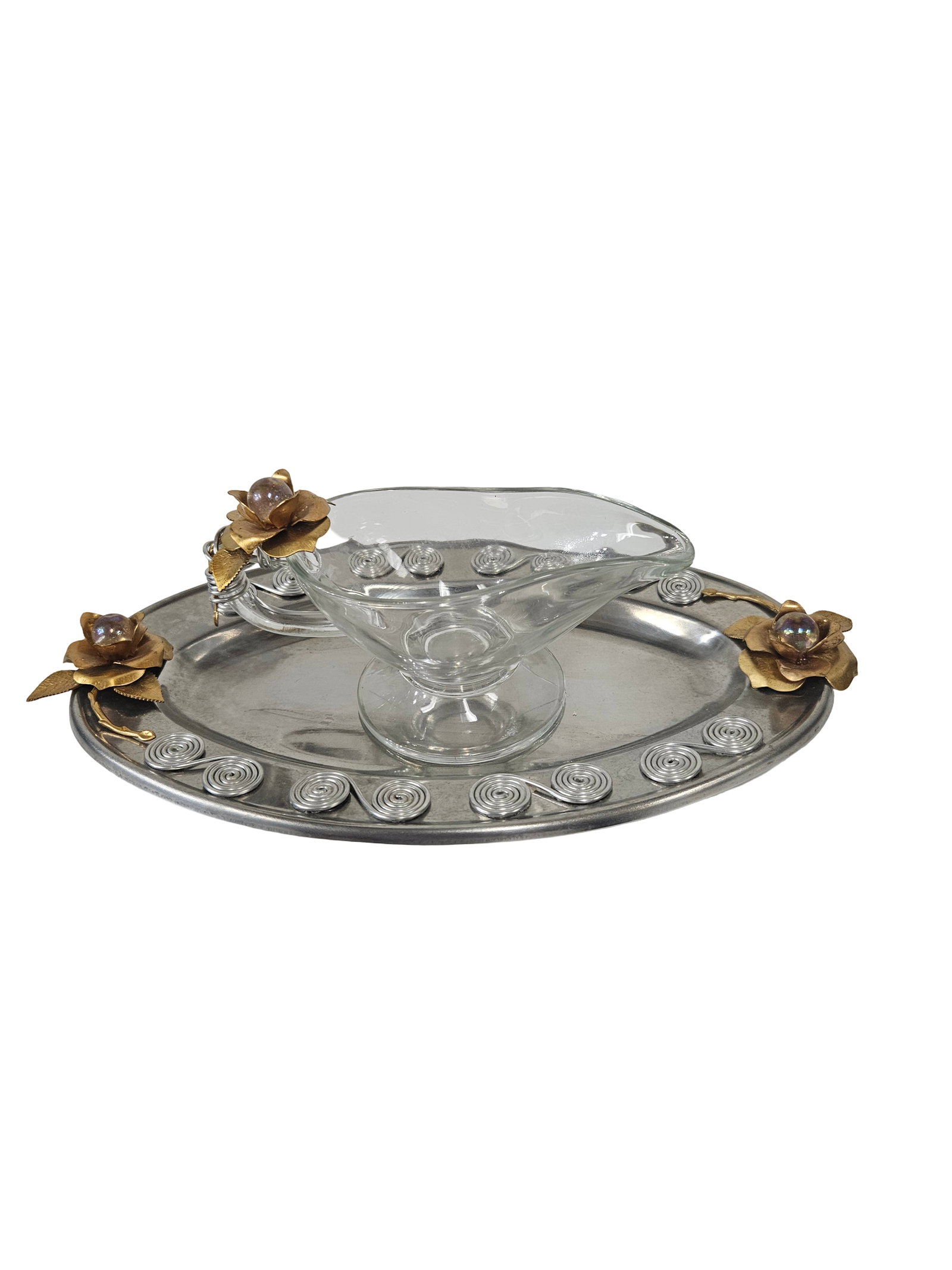 Glass Gravy Boat with Floral Metal Tray: A decorative table serving set featuring a clear glass gravy boat and a coordinating oval metal tray. The set is uniquely accented with gold-toned metal rose blossoms containing iridescent glass bead 