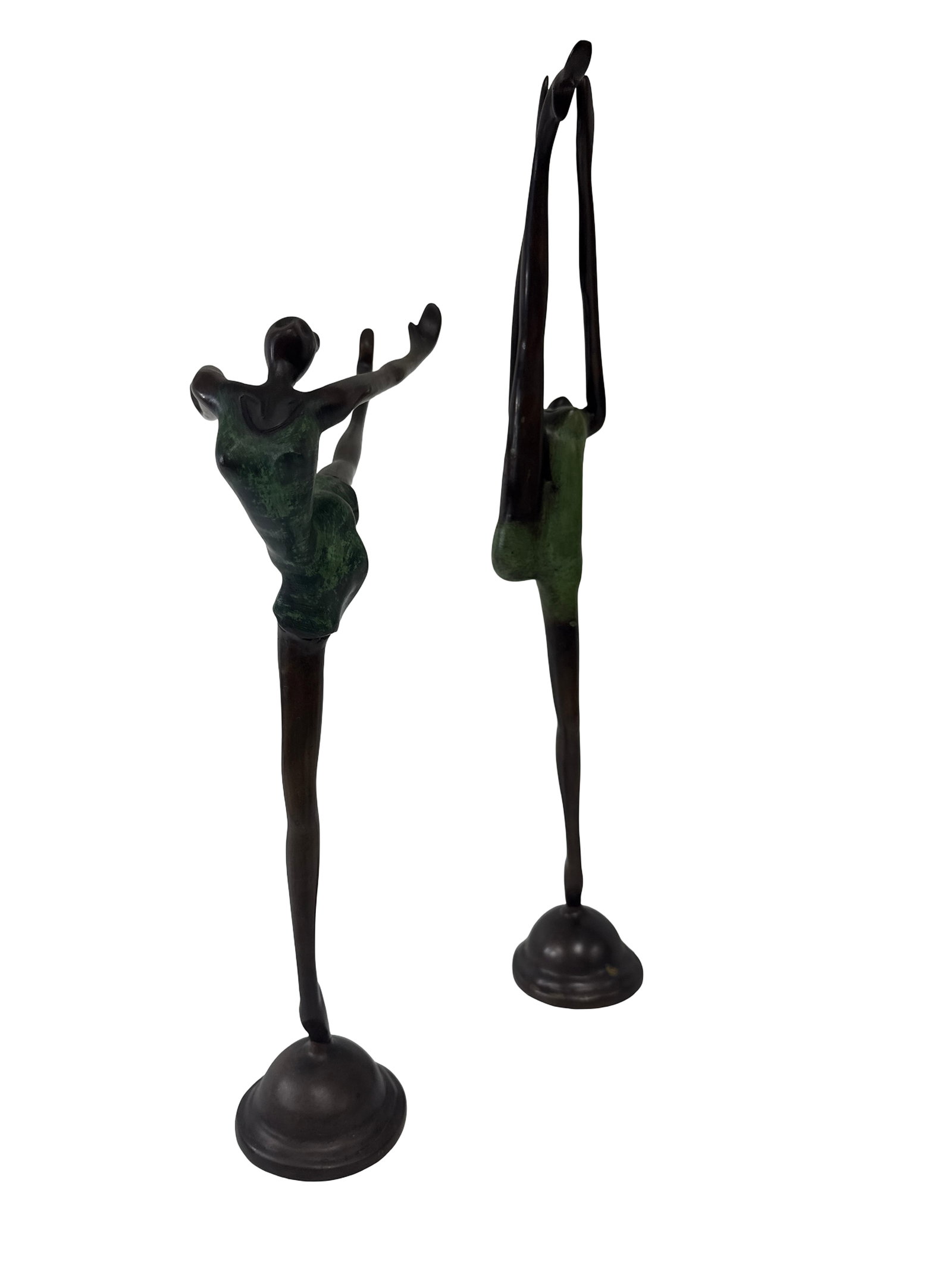 Two Modernist Elongated Dancer Statues: Two elongated bronze-tone sculptures of female dancers in dynamic, athletic poses. Each figure features a distinctive verdigris or green-colored patina on the torso and costume, contrasting with the