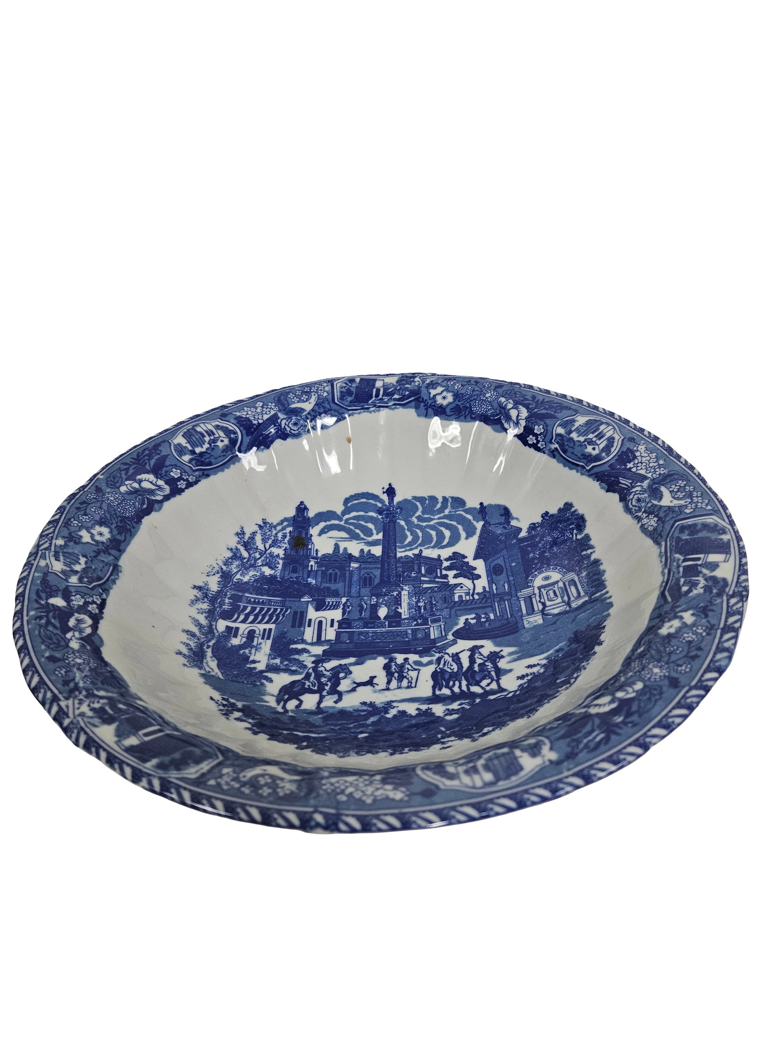 Large Blue Transferware Estate Basin: This large earthenware wash basin features a classic cobalt blue transferware design depicting an elaborate neoclassical estate and monument scene. The interior and exterior are decorated with