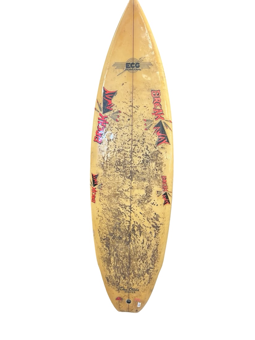 Vintage Dan Ollila Shapes Surfboard: This vintage surfboard features custom shaping attributed to Dan Ollila and prominently displays 'Break Away' graphics across the deck. The board is designed with a classic pointed nose and includes