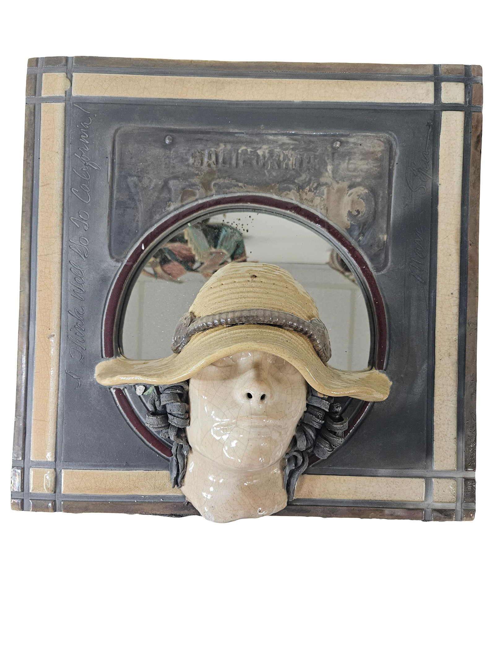 Ceramic California Mirror Wall Relief: This unique mixed-media wall sculpture features a high-relief ceramic face with a wide-brimmed hat set against a central round mirror. The background is a large ceramic plaque incorporating an
