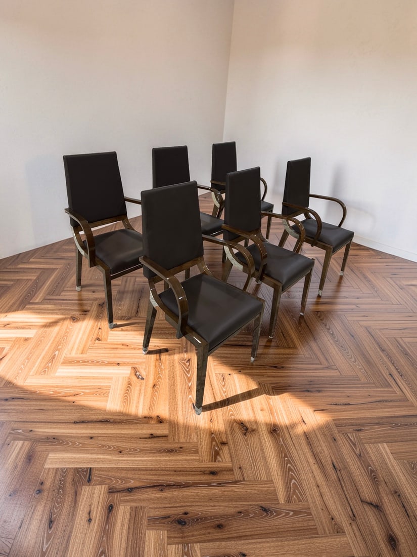 Set of 6 Art Deco Style Dining Chairs: This set of six dining armchairs features a sophisticated Art Deco inspired design with high backs and curved arms. The frames are constructed from high-polish burl wood or similar veneer accented by 