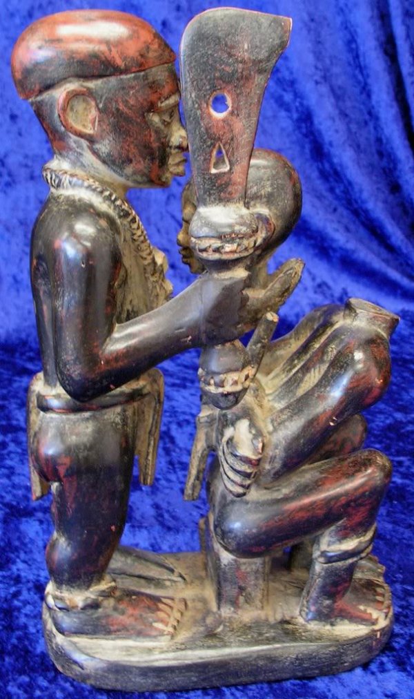 Antique Carved Wood African Headhunter Figurine: Wooden African Headhunter Native Figures. Made in the Ivory Coast. Hand carved/ Size: Height: 13"