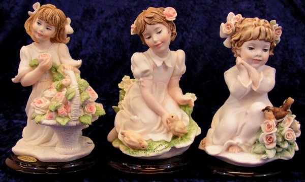 Florence Italian Giuseppe Armani Ceramic Figurines: Three Piece Set Florence Giuseppe Armani Figurines. 1999 Cherie, 2001 Springtime of Life, 2003 Sweet Song. Made in Florence Italy Size: 4 1/2" tall, 3" wide,