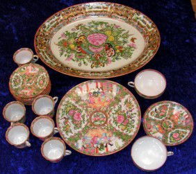 Chinese Red Rose Famille Hand Painted China: Vintage 18 piece set of Handpainted Porcelain Red Rose Famille China. Stamped with "Made In China". Includes 1 serving tray, 1 plate, two tea cups with 2 saucers, six miniature tea cups with saucers.