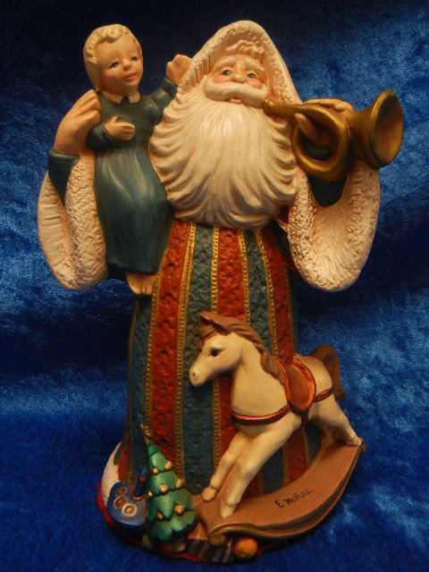 Vintage Father Christmas With Child and Toys: A beautiful Ceramic Father Christmas Figurine holding a child and horn