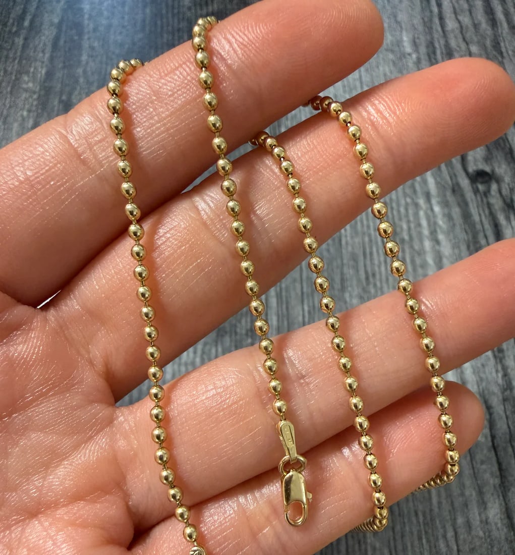 Uno A Erre 14K Gold Ball Chain, 18.25" Long: Metal: 14K Yellow Gold Weight: 8.2 gramsMeasurements: 18.25 inches long by 2.2 mm wideMarkings: "Italy" "14K Uno a Erre"Condition: In good condition with an old repair between 2 links. Some minor