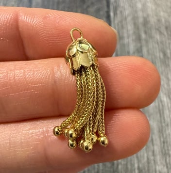 Vintage 14K Gold Tassel Charm: A classic 14K yellow gold tassel charm with fluid movement, perfect for a necklace or bracelet.