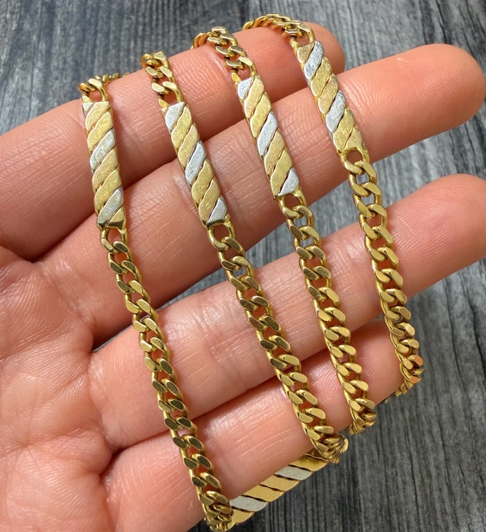 Vintage 18K Bicolor Gold Curb Link Station Chain: An 18-inch necklace featuring alternating yellow and white 18K gold curb link stations for a tricolor effect.