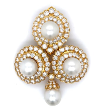 18K Yellow Gold South Sea Pearl & Diamond Brooch: 18K Yellow Gold; South Sea Pearl with Diamond floral/scroll accents.