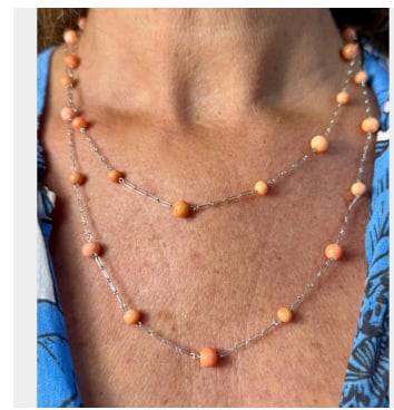 Platinum Coral Necklace: Platinum; beaded Coral necklace with a platinum clasp.