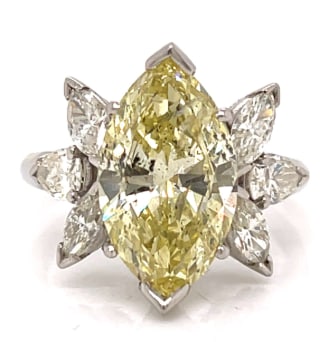 1950’s Platinum Fancy Yellow Diamond Ring: Platinum; 1950's vintage style featuring a Fancy Yellow Diamond.