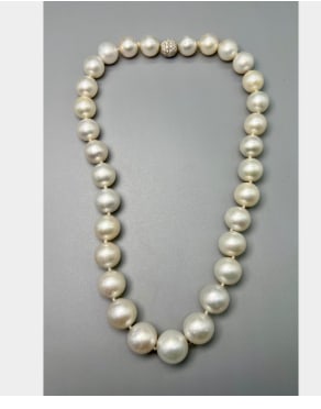 18K White Gold Graduated South Sea Pearl and Diamond Clasp Necklace: 18K White Gold; Graduated South Sea Pearls with a Diamond-set clasp.