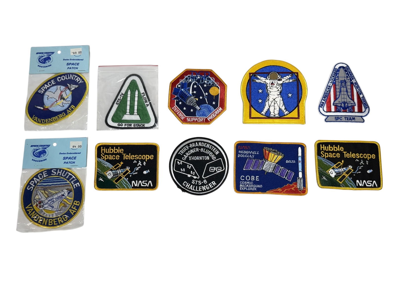Collection of 10 NASA Space Shuttle, Hubble & C.O.B.E. Patches: A group of ten NASA embroidered patches, including Space Shuttle Vandenberg AFB designs, Hubble Space Telescope mission patches, COBE (Cosmic Background Explorer), and STS-8 Challenger crew patch.
